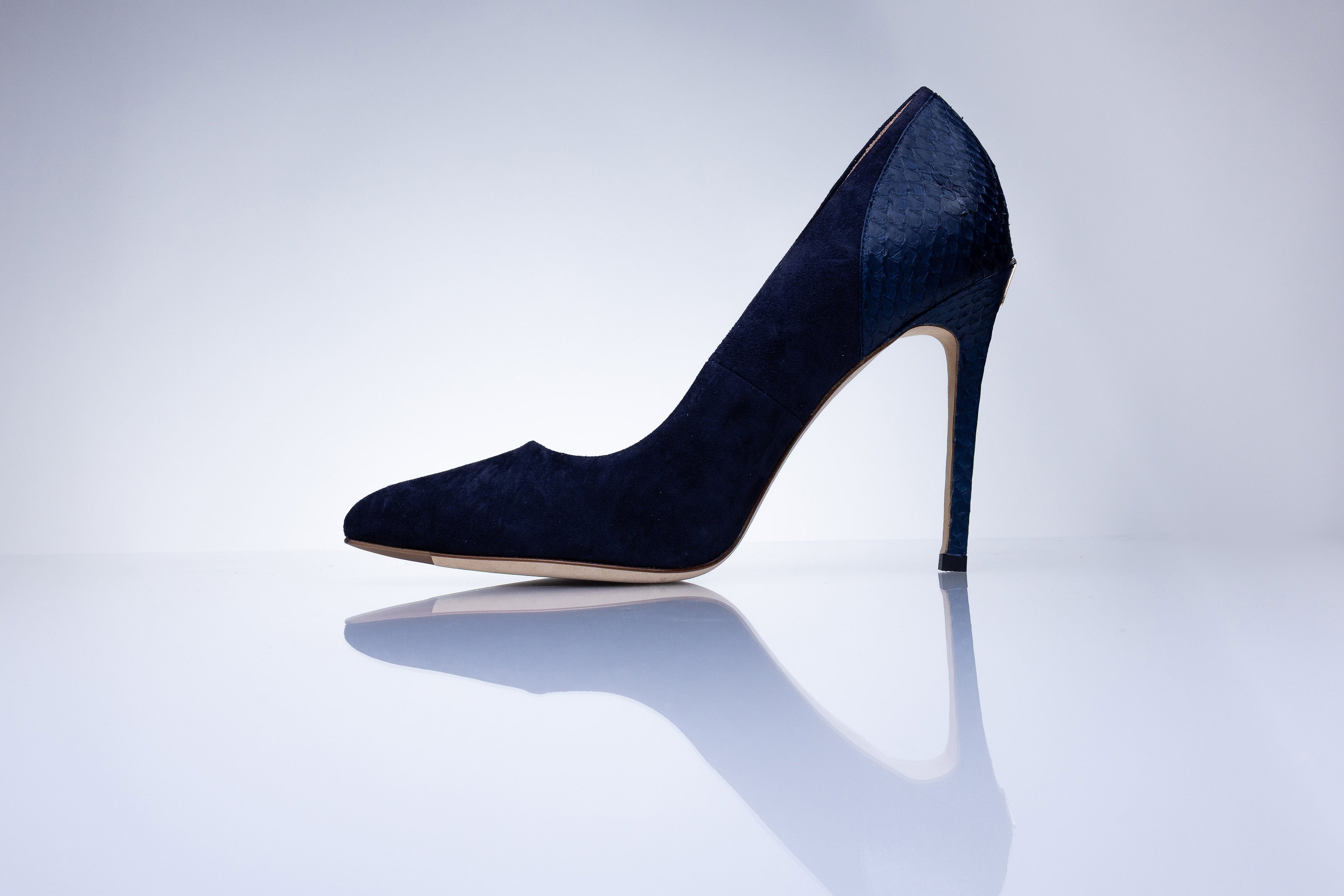Rear view of Elandetta Baltic Blue heels highlighting textured navy leather detailing and signature heel silhouette.