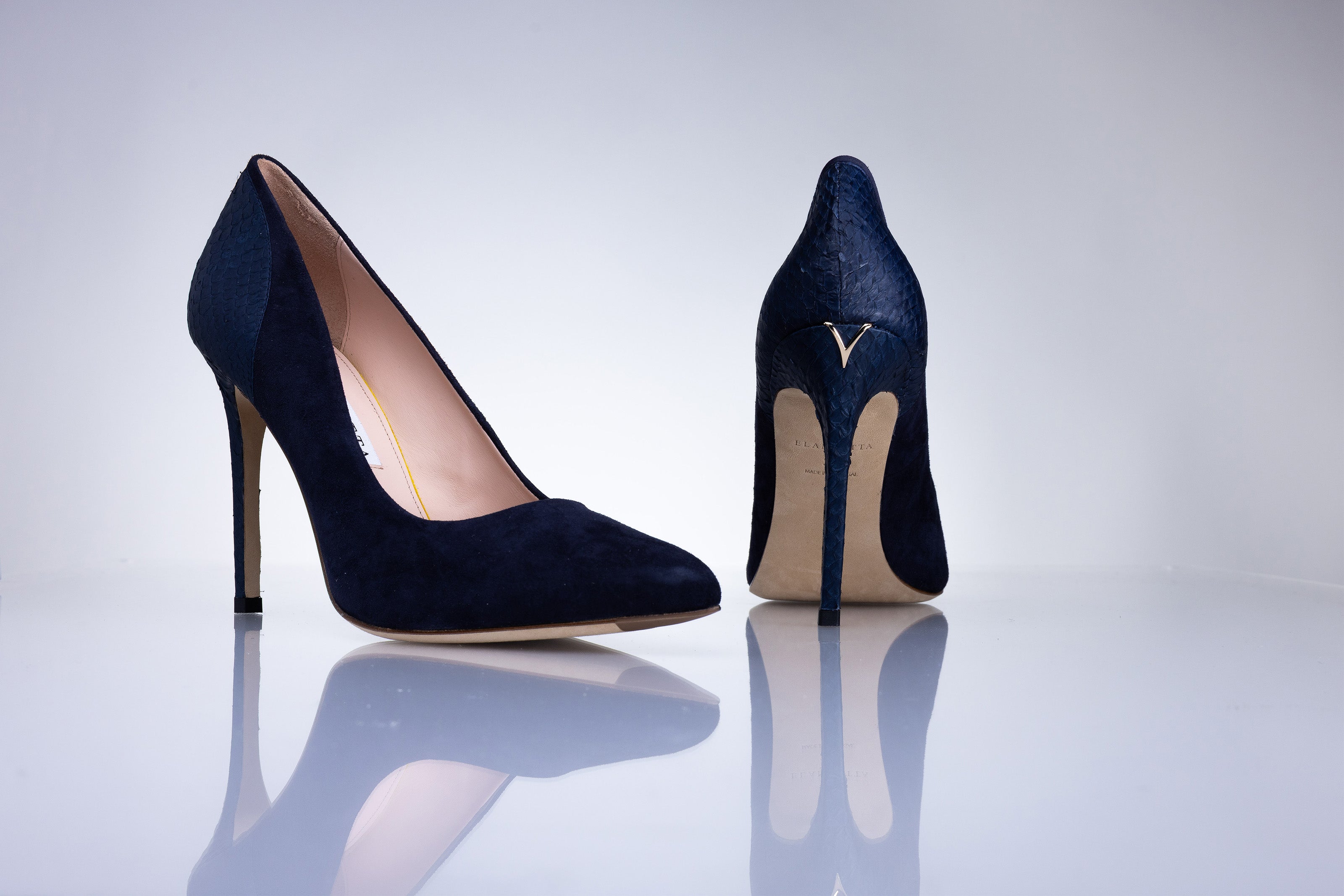 Side profile of the Elandetta Baltic Blue luxury suede heel with slim stiletto silhouette and deep navy tones.