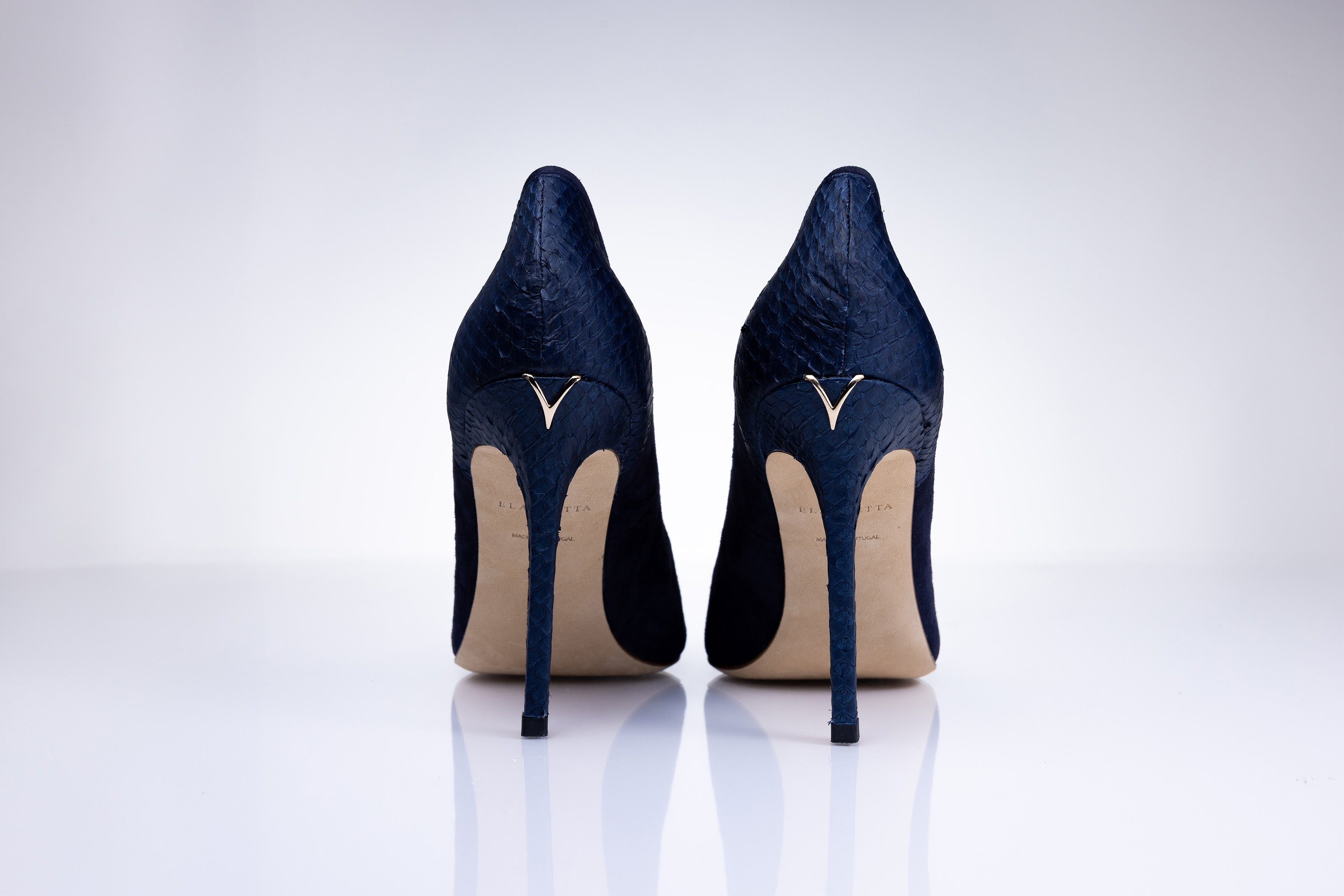 Rear view of Elandetta Baltic Blue heels highlighting textured navy leather detailing and signature heel silhouette.