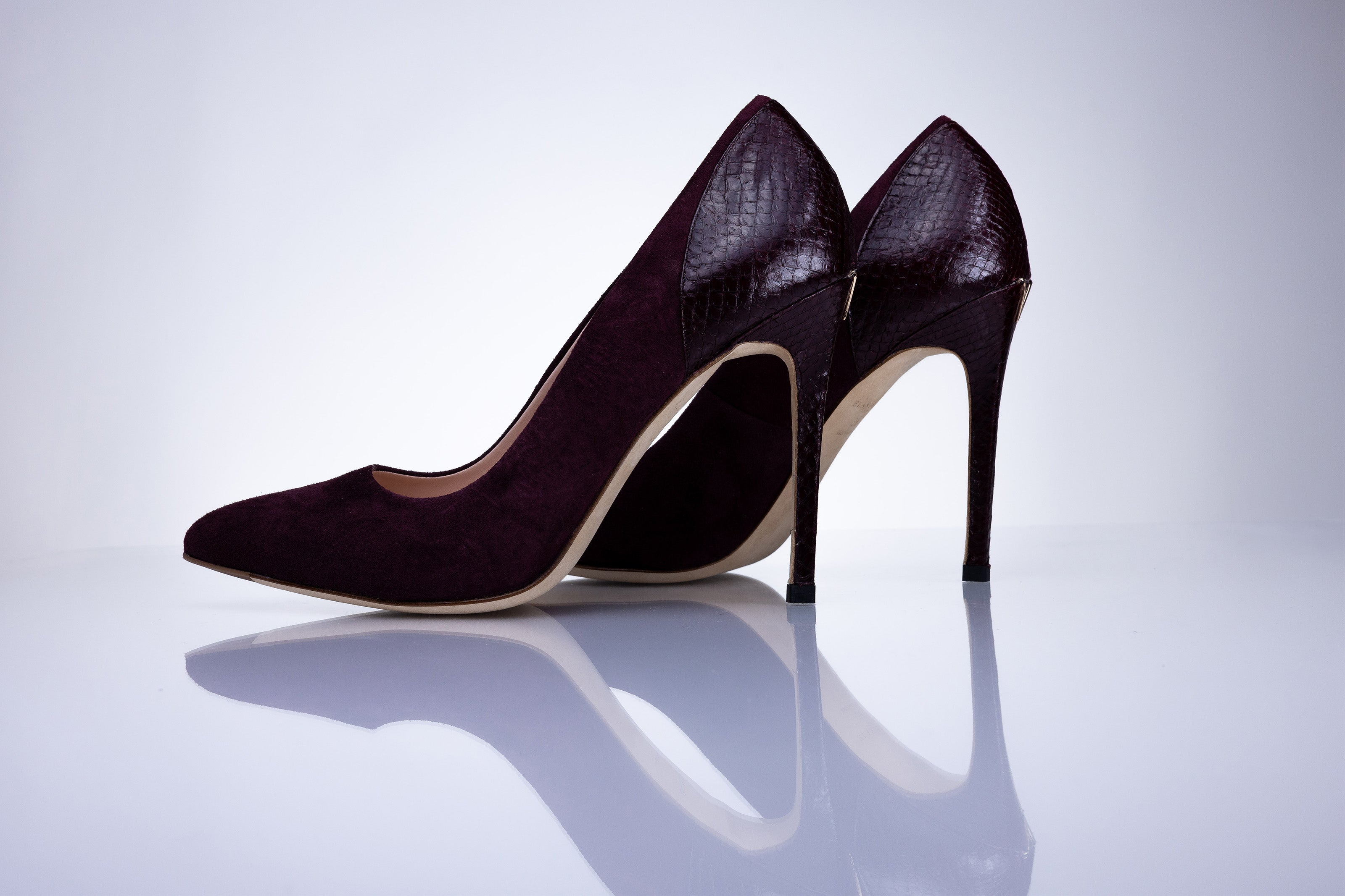Elandetta Bordeaux pointed suede heels in a deep burgundy red shade with sculpted stiletto heels.