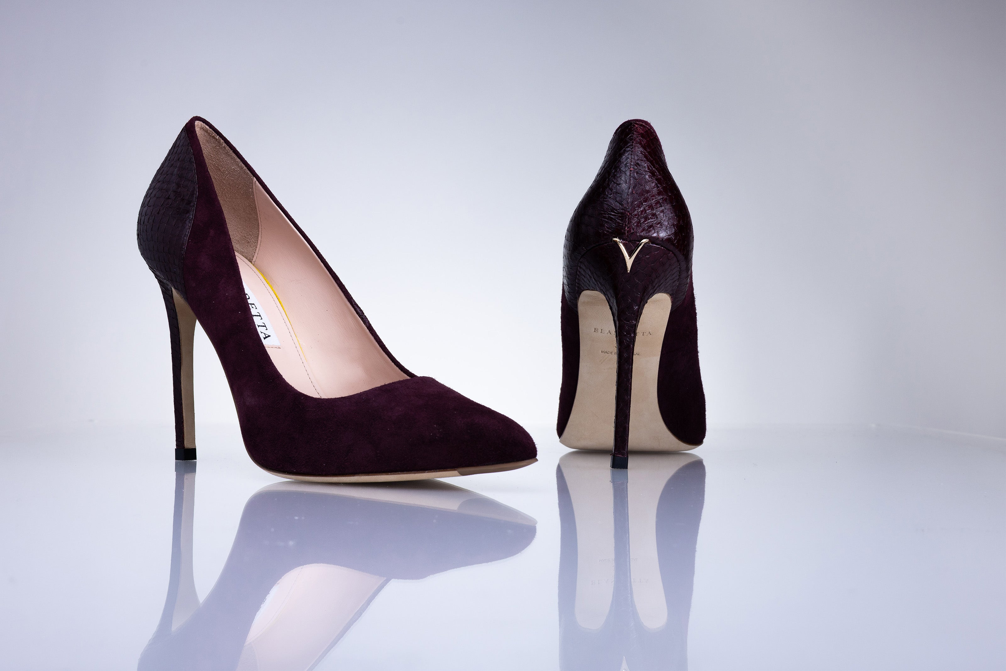 Angled view of Elandetta Bordeaux deep burgundy suede heels with refined pointed toe and slim stiletto heel.