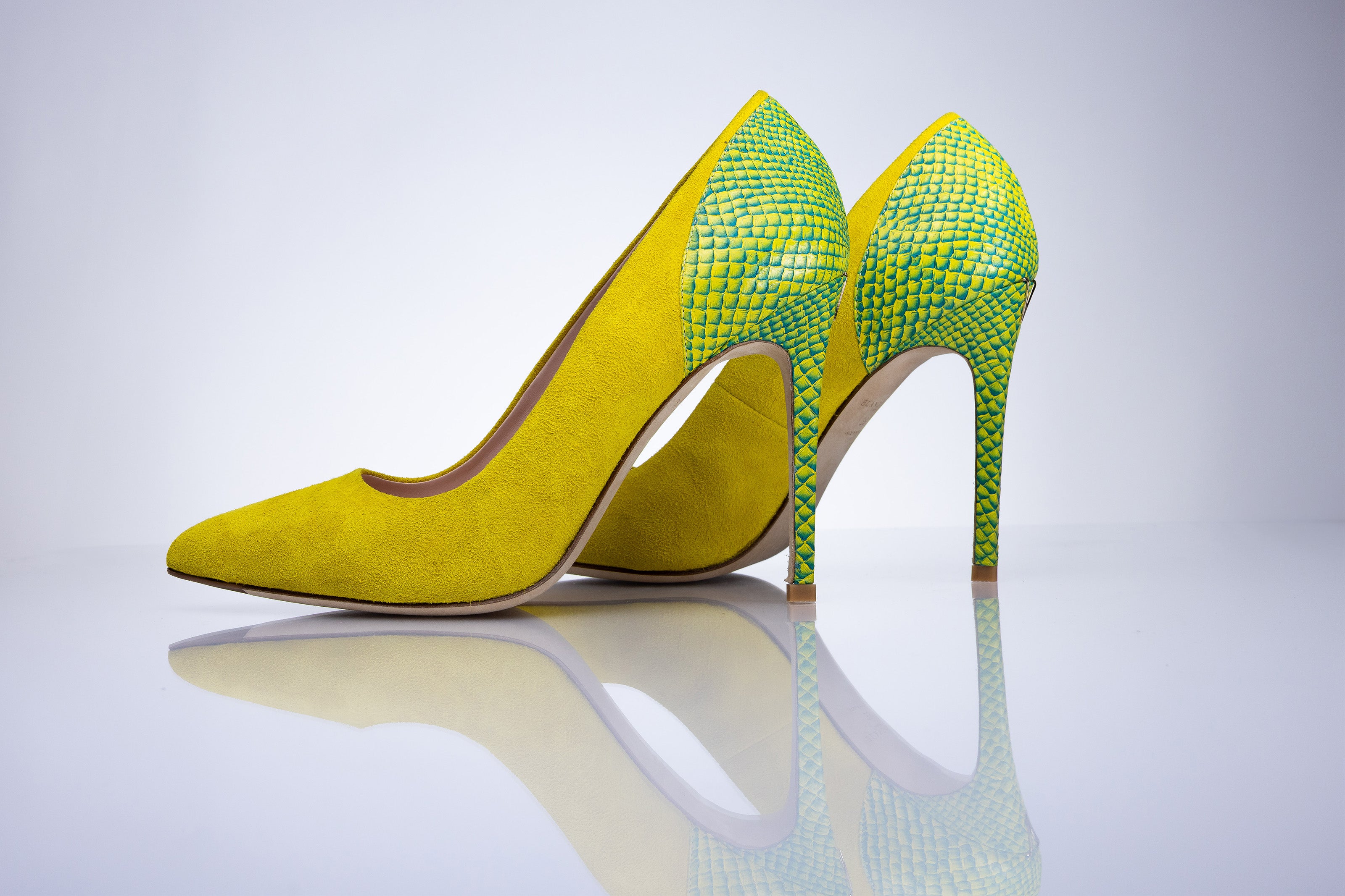 Elandetta Bouee luxury yellow suede heel showcasing elegant pointed toe shape and sculpted stiletto heel.