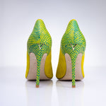 Rear angle of Elandetta Bouee heels highlighting green textured leather detailing and slim heel silhouette.
