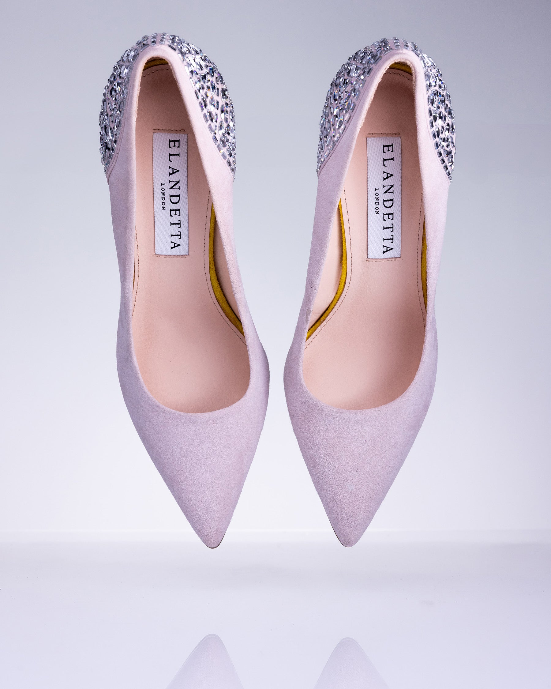 Pair of Elandetta Heather cool pink suede pointed heels with hand embellished crystal detailing and elegant silhouette.
