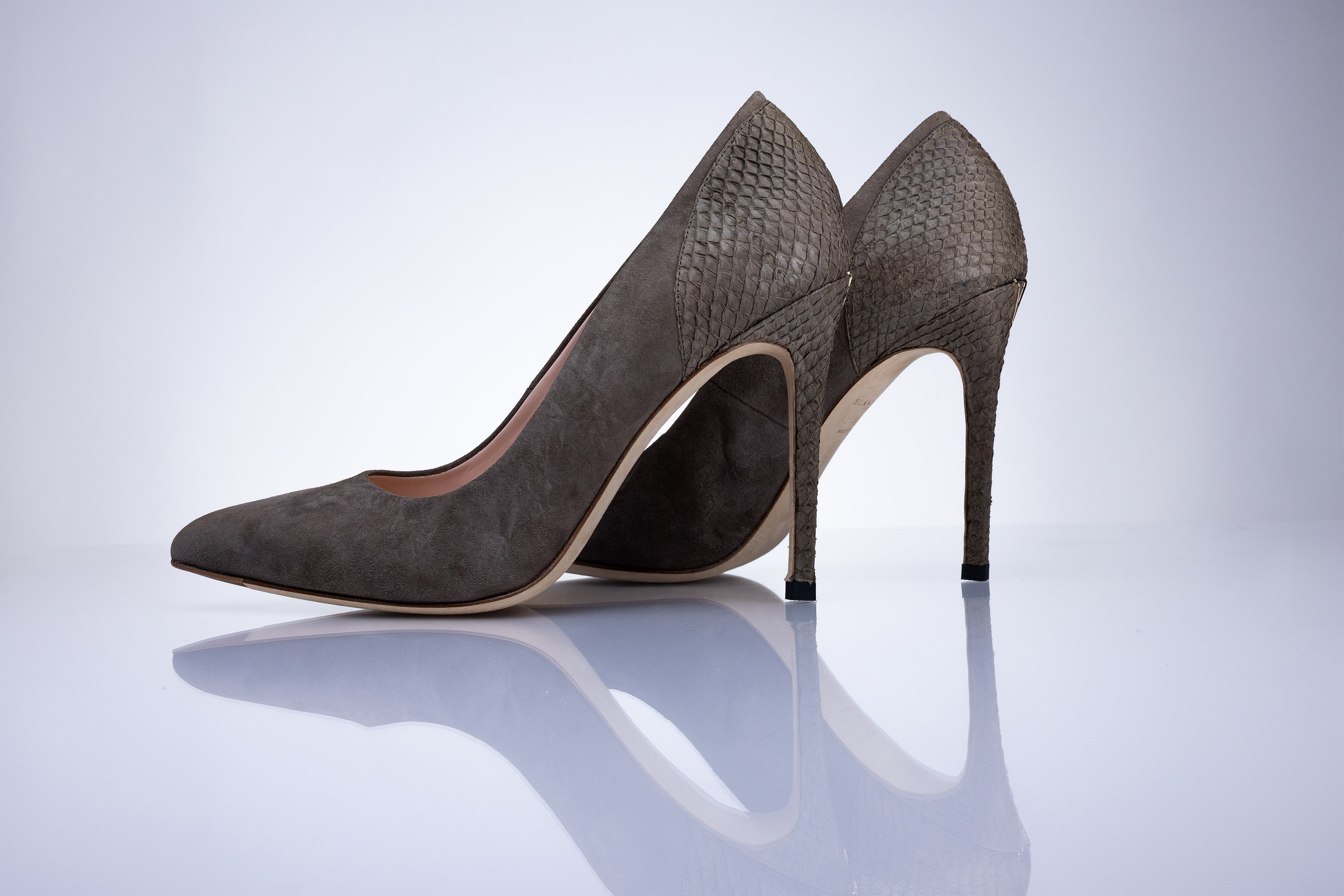 Angled view of Elandetta Moka taupe mushroom suede heels with elegant stiletto silhouette and textured leather finish.