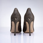 Rear view of Elandetta Moka heels highlighting textured taupe leather detailing and signature heel silhouette.