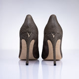 Rear view of Elandetta Moka heels highlighting textured taupe leather detailing and signature heel silhouette.