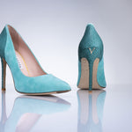 Side profile of the Elandetta Sage Green suede heel featuring aqua blue undertones and slim stiletto heel.