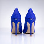 Rear view of Elandetta Ultraviolet electric blue suede heels featuring sleek stiletto heels and signature detailing.