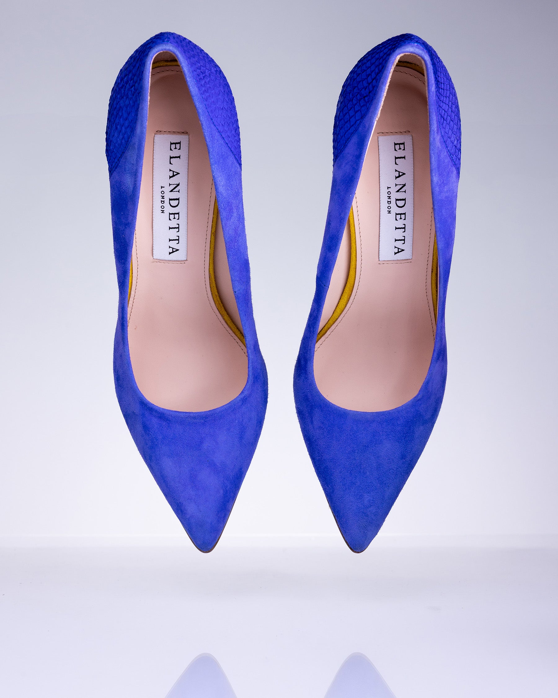 Pair of Elandetta Ultraviolet electric blue suede heels with pointed toe silhouette and luxury leather lining.