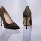 A pair of pointed-toe high heels in textured taupe suede, shown from the front and back on a reflective light gray studio surface. The brand name Elandetta is visible on the insole.