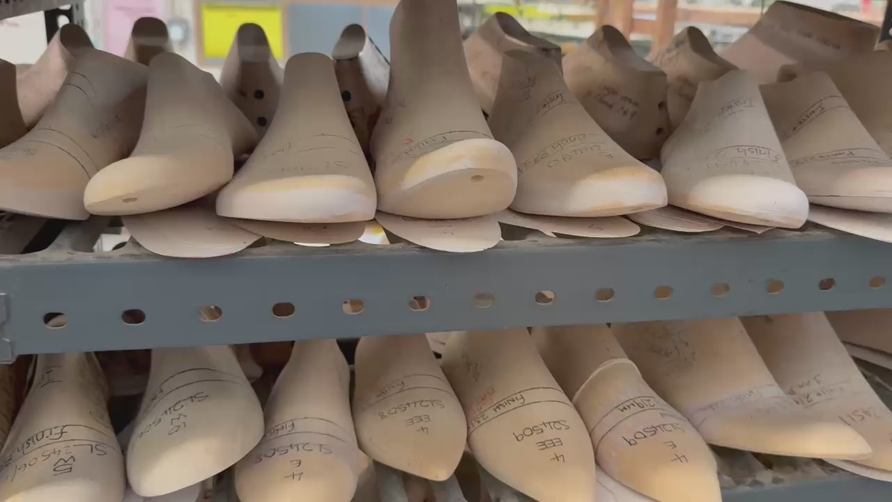 Video of traditional shoemaking lasts stored in a workshop during the development of Elandetta luxury pointed heels. The footage highlights the craftsmanship, precision fitting and artisanal process behind Elandetta’s colour-led footwear, inspired by British shoemaking heritage and designed for lasting quality.